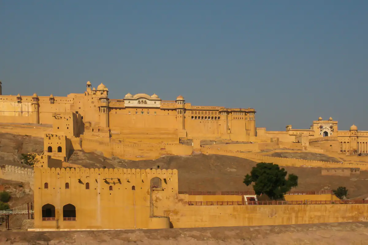 Amer Fort stretched along the ridge above Jaipur in golden light
