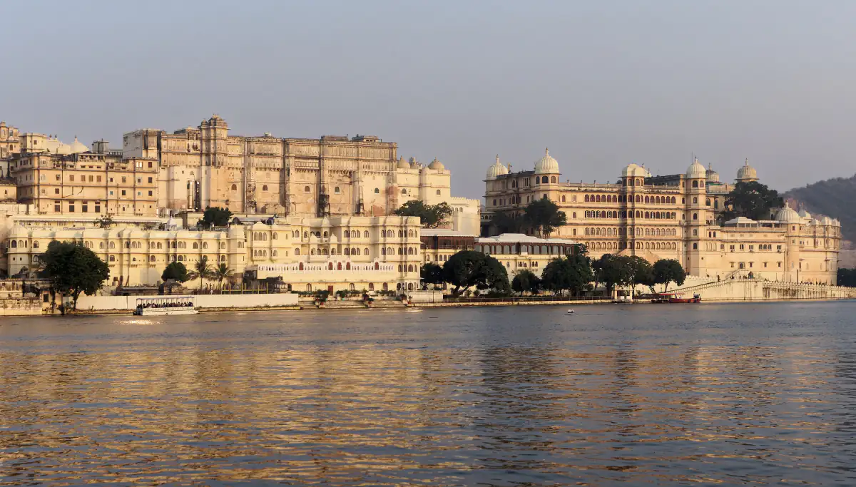 City Palace of Udaipur rising above Lake Pichola in late afternoon light