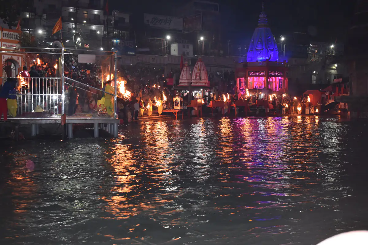 Evening Ganga aarti lamps reflected in the river at Har Ki Pauri, Haridwar