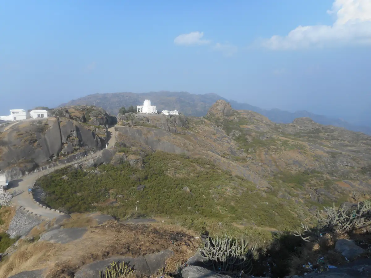 Guru Shikhar, the highest peak of the Aravallis, with its hilltop temple and winding path near Mount Abu
