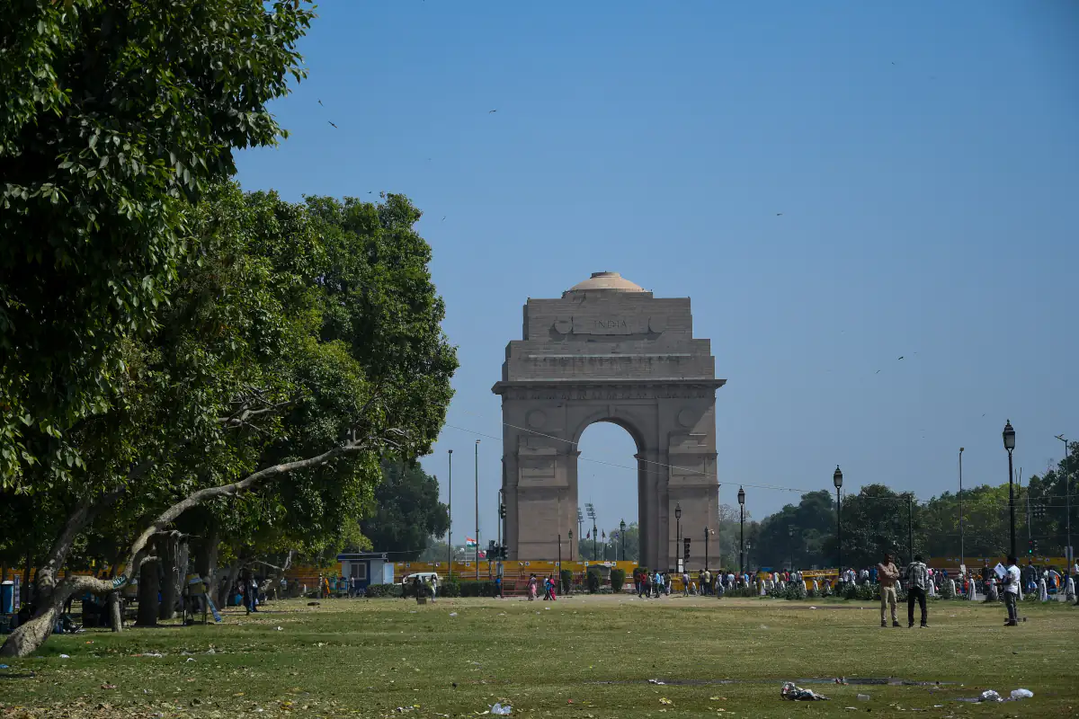 India Gate war memorial arch seen across the lawns in New Delhi