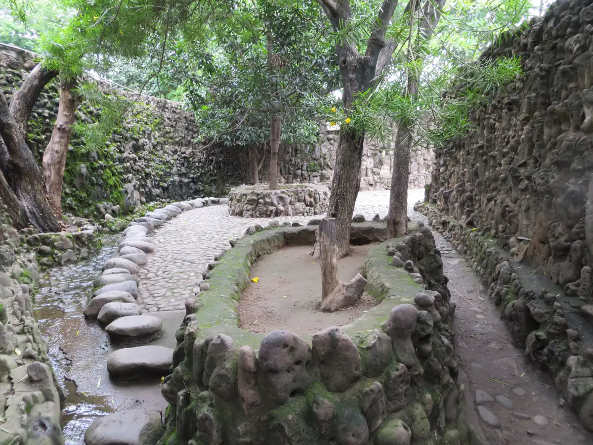 Winding pebble paths and stone walls inside Nek Chand's Rock Garden, Chandigarh